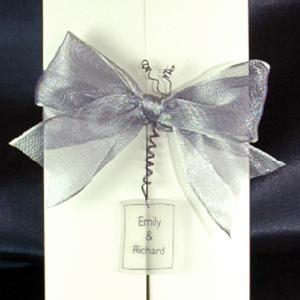 Centre opening wedding invitations dont just have to have a bow! This one as a personalised handmade ornament as well!
